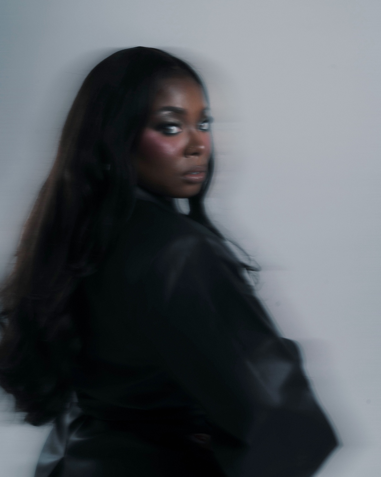 Motion-blurred portrait of Sierra Von turning toward the camera